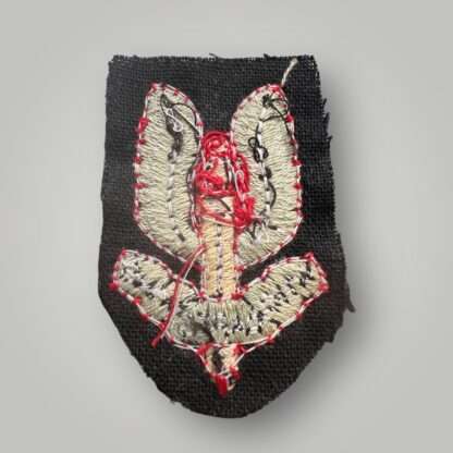 Reverse image of a Special Air Service Beret Badge post war circa 2000, machine embroidered.