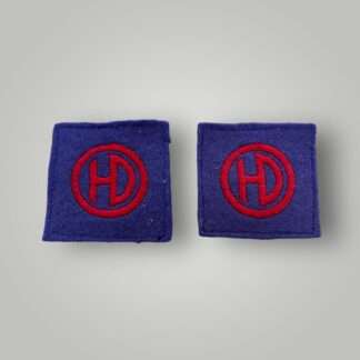 An original set of British WW2 51st Highland Division formation badges, machine embroiderd depicting the letters HD conjoined in red within a red circle on a blue woollen backing.