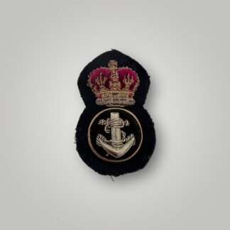 A British Royal Navy Petty QEII Officer's cap badge post war, hand embroidered in bullion wire and felt.