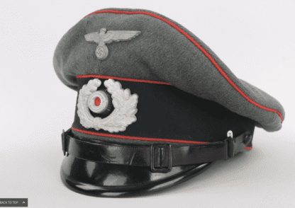 An early Heer Flak EM/NCOs Visor Cap By Wilhelm Wethekam, constructed with grey-green felted doeskin with three bands of red pipping for Flak/Artillery units with dark green woolen band for Army/Heer and leather chin