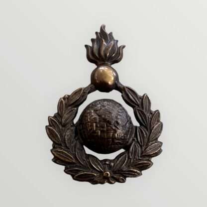 A rare orginal Royal Marines Artillery Sergeants Forage Cap Badge 1921 - 1923, constructed in brass. The badge depicts the classic Royal Marines Globe surrounded by a laurel wreath, surmounted by a grenade fired proper.