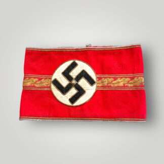 This NSDAP Political Leader Ortsgruppe-Level armband worn by political leaders at local level for the Third Reich.