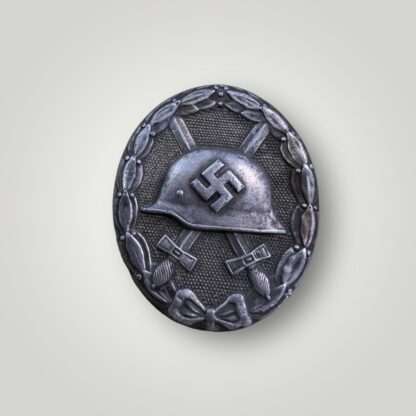 An original WW2 German wound badge in silver by Juncker, constructed in tombac with nice silver wash and patina.