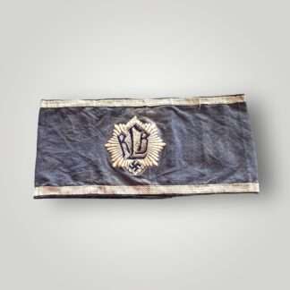 An early RLB (Reichsluftschutzbund) Air Raid League Officers Armband 1st pattern. The armband is made of quality mid-blue cotton material with a machine embroidered RLB emblem on the front.