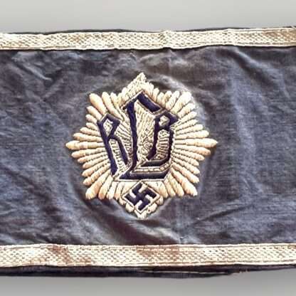 An early RLB (Reichsluftschutzbund) Air Raid League Officers Armband 1st pattern. The armband is made of quality mid-blue cotton material with a machine embroidered RLB emblem on the front.