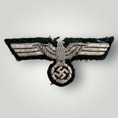 An original Heer Officer's Breast Eagle uniform removed, hand-embroidered in silvered bullion wire.