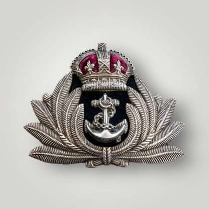 An original British WW2 Royal Navy Officers Cap Badge,  brass and white metal construction.