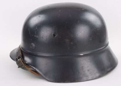 A Luftschutz M40 Helmet (beaded rim) No Decal - NS64, late war example with dark blue factory paint finish with no decal.