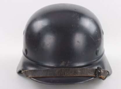 An original Luftschutz M40 Helmet (beaded rim) No Decal - NS64, late war example with dark blue factory paint finish with no decal.