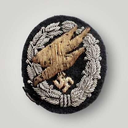 An extremly rare Luftwaffe Fallschirmjäger Officer's Bullion Cloth Badge, hand made in gold and silver bullion thread on dark blue woollen backing.