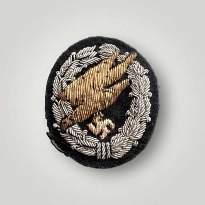 An extremly rare Luftwaffe Fallschirmjäger Officer's Bullion Cloth Badge, hand made in gold and silver bullion thread on dark blue woollen backing.