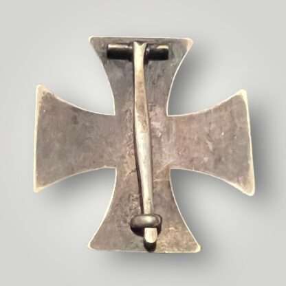 Reverse image of a WW1 German Iron Cross 1st Class 1914 three-part construction with magnetic iron core, with beautiful patina.