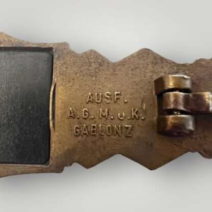 An authentic WW2 German Close Combat Clasp Bronze by A.G. M.u.K. Gablonz 1st pattern, constructed in zink with 90% of the bronze finish intact.