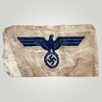 A rare Kriegsmarine WW2 sailor shirt ‘BeVo’ breast eagle, machine embroidered in blue thread on white backing.