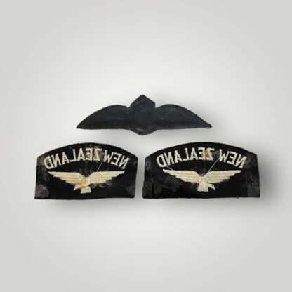 Reverse image of an WW2 Royal New Zealand Air Force pilot wings & set of shoulder titles.