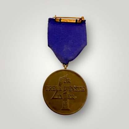 An SS Long Service Medal four years, constructed in tombak with tear drop suspension ring.