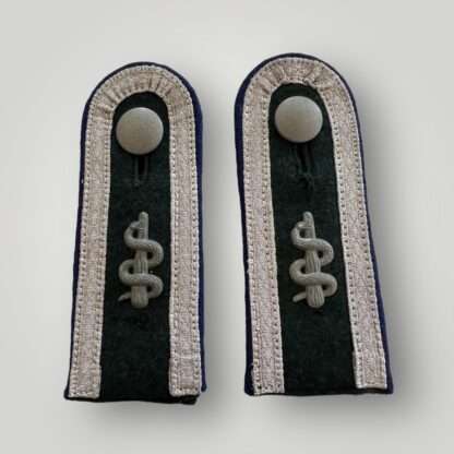 A set of Heer Heer Medical Sanitäts Unteroffizier shoulder boards, complete with purple pipping, with medical rod of sclepius and silver peppled buttons.