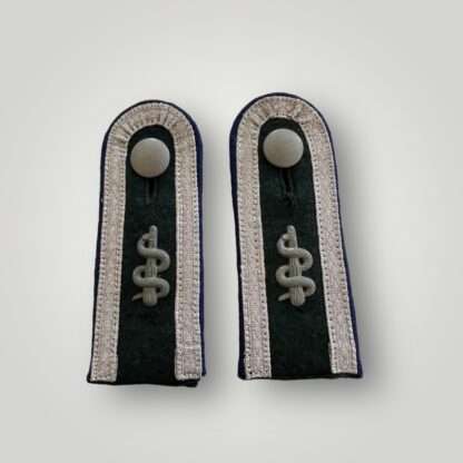 A set of Heer Heer Medical Sanitäts Unteroffizier shoulder boards, complete with purple pipping, with medical rod of sclepius and silver peppled buttons.