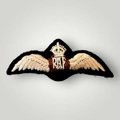 A genuine Royal Air Force WW2 Paddeed Pilot Wings, embroidered pair of outstretched wings supporting a central laurel wreath encircling the RAF monogram with above a King's crown, the wings, monogram, and crown in cream, and the wreath in brown on black padded backing.