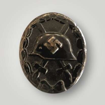 An original WW2 German Wound Badge Black 1939 by Eduard Hahn, die-stamped in steel with nice factory paint finish.