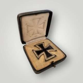 An original Iron Cross 1st Class By Wächtler & Lange with presentation case, with a nice blackened magnetic iron core and ribbed border, with a raised swastika in the centre and institution date 1939 below.