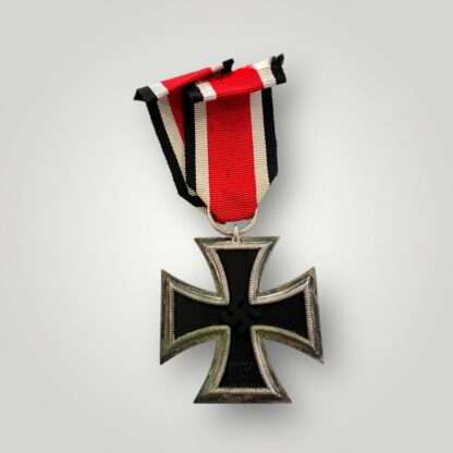 A rare WW2 German Iron Cross 2nd class medal by Eugen Gauss, two part construction with magnetic iron core with original ribbon. The obverse of the medal has beautiful patina with nice silver plated frame with original factory paint finish.