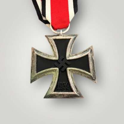 A rare WW2 German Iron Cross 2nd class medal by Eugen Gauss, two part construction with magnetic iron core with original ribbon. The obverse of the medal has beautiful patina with nice silver plated frame with original factory paint finish.