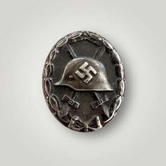 An original WW2 German Wound Badge Black 1939 By Rudolf Wachtler & Lange, die-stamped in steel with nice factory paint finish