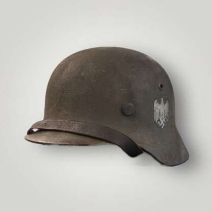 An original M40 single decal with textured field grey paint complete with leather chin strap.