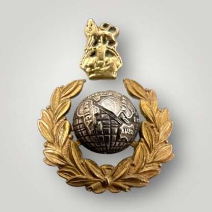 An original British WW2 Royal Marines officers commando cap badge, two part construction in brass and white metal.