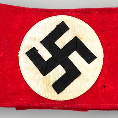 An early WW2 NSDAP Party Members Armband (National Socialist German Worker’s Party/Nationalsozialistische Deutsche Arbeiterpartei) two-part construction in red wool.