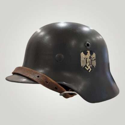 A WW2 German M35 Heer Single Decal helmet, with leather strap.