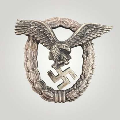 A desirable Luftwaffe Pilots Badge By Gebr Wegerhoff GWL, the eagle is constructed in nickle silver with a tombac wreath with nice patina and polished edges.