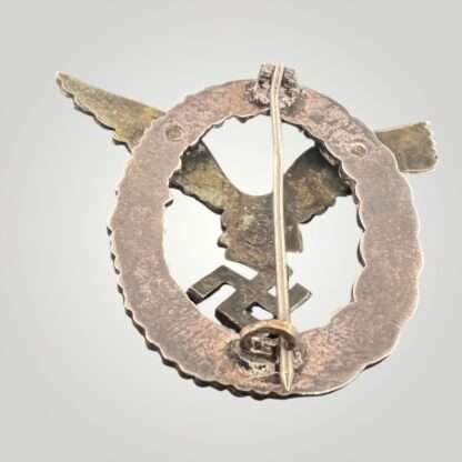 Reverse image of a Luftwaffe Pilots Badge By Gebr Wegerhoff GWL, the eagle is constructed in nickle silver with a tombac wreath.