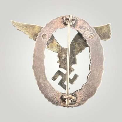 Reverse image of a Luftwaffe Pilots Badge By Gebr Wegerhoff GWL, the eagle is constructed in nickle silver with a tombac wreath.