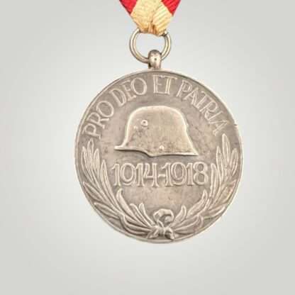 An original 1914-1918 Austro Hungarian Commemorative Medal For Combatants, constructed in silvred bronze with suspension ring with period tri fold ribbon.