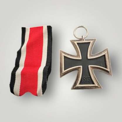 Reverse photo of a German WW2 Iron Cross EK2 1939 by Jakob Bengel Oberstein, three part contruction with magnetic iron core with original factory paint finish.