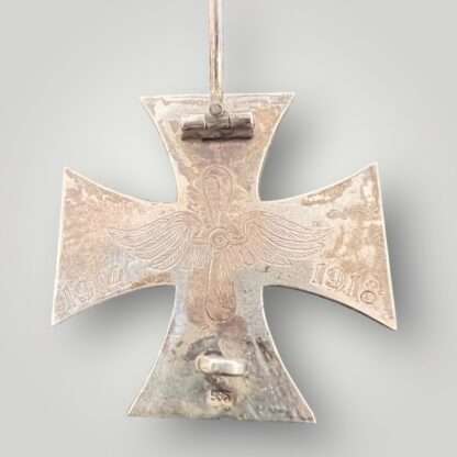 Reverse image of a WW1 German Iron Cross engraved 1914 and 1918 on each arm with Imperial Air Force motif in the centre.