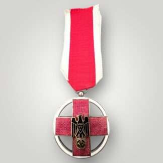 A rare German Cross Of Honor Medal 1937-1939, constructed in red, white, black, and gold enamel with a silver supension ring and ribbon.