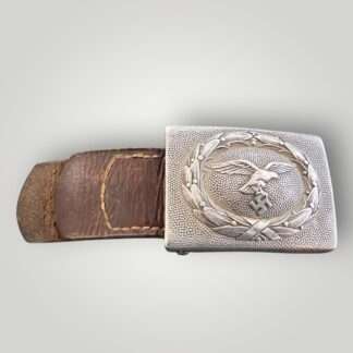 An early Luftwaffe belt buckle by Franz Reischauer 1937 with leather tab constructed in alluminium.