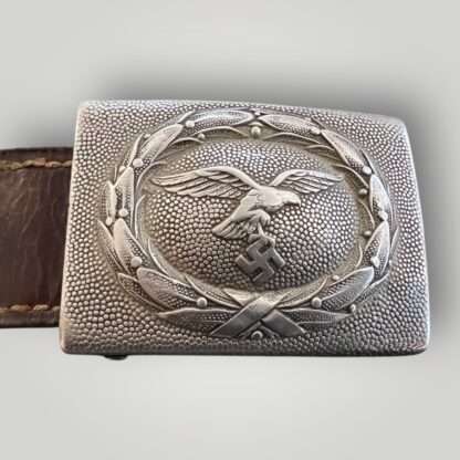 An early Luftwaffe belt buckle by Franz Reischauer 1937 with leather tab constructed in alluminium.