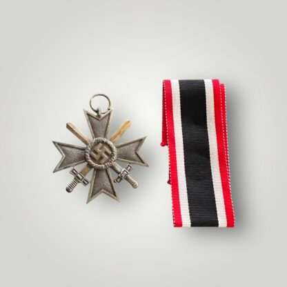 An original WW2 German War Merit Cross with swords 2nd class medal, die-struck construction in zinc with a bronze finish.