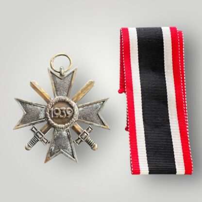 Reverse image of an original WW2 German War Merit Cross with swords 2nd class medal, die-struck construction in zinc with a bronze finish.