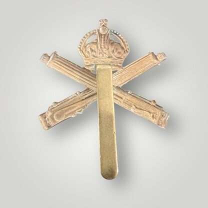 Reverse image of a British WW1 Machine Gun Corp Cap Badge, constructed in brass.