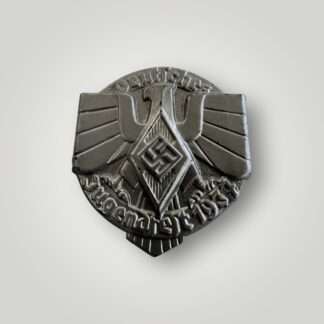 A German Hitler Youth 1937 Event Badge (Jugendfest Abzeichen) constructed in steel die stamped with silver finish.