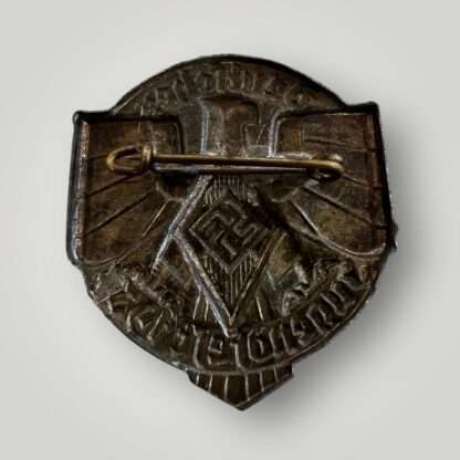 Reverse image of a German Hitler Youth 1937 Event Badge (Jugendfest Abzeichen) constructed in steel die stamped with silver finish.