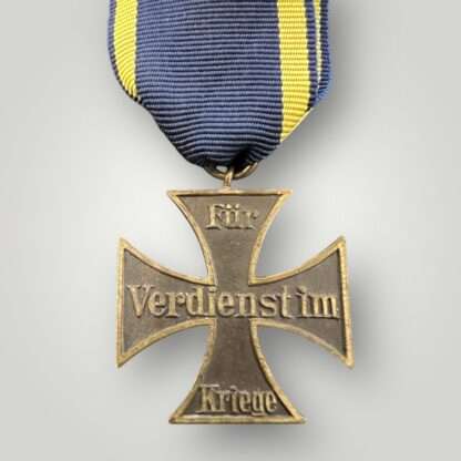 Reverse image of a German WW1 Brunswick War Merit Cross second class. The medal is unmarked and constructed in dark bronze.