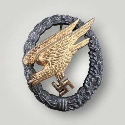 An early Luftwaffe Fallschirmjäger Badge by GWL. The eagle is constructed in brass alloy (tombak) and the wreath in zink.