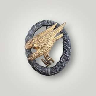 An early Luftwaffe Fallschirmjäger Badge by GWL. The eagle is constructed in brass alloy (tombak) and the wreath in zink