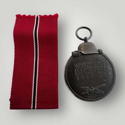 Reverse image of an original Eastern Front Medal, constructed in zinc with nice long ribbon.